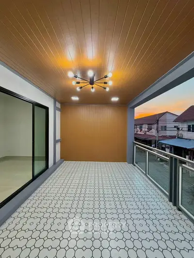 Spacious balcony with modern lighting and sunset view in a stylish residential property.