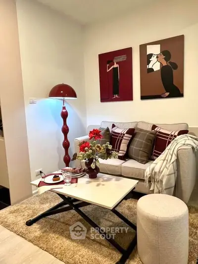 Chic living room with modern decor, cozy sofa, stylish artwork, and elegant lighting for a sophisticated ambiance.
