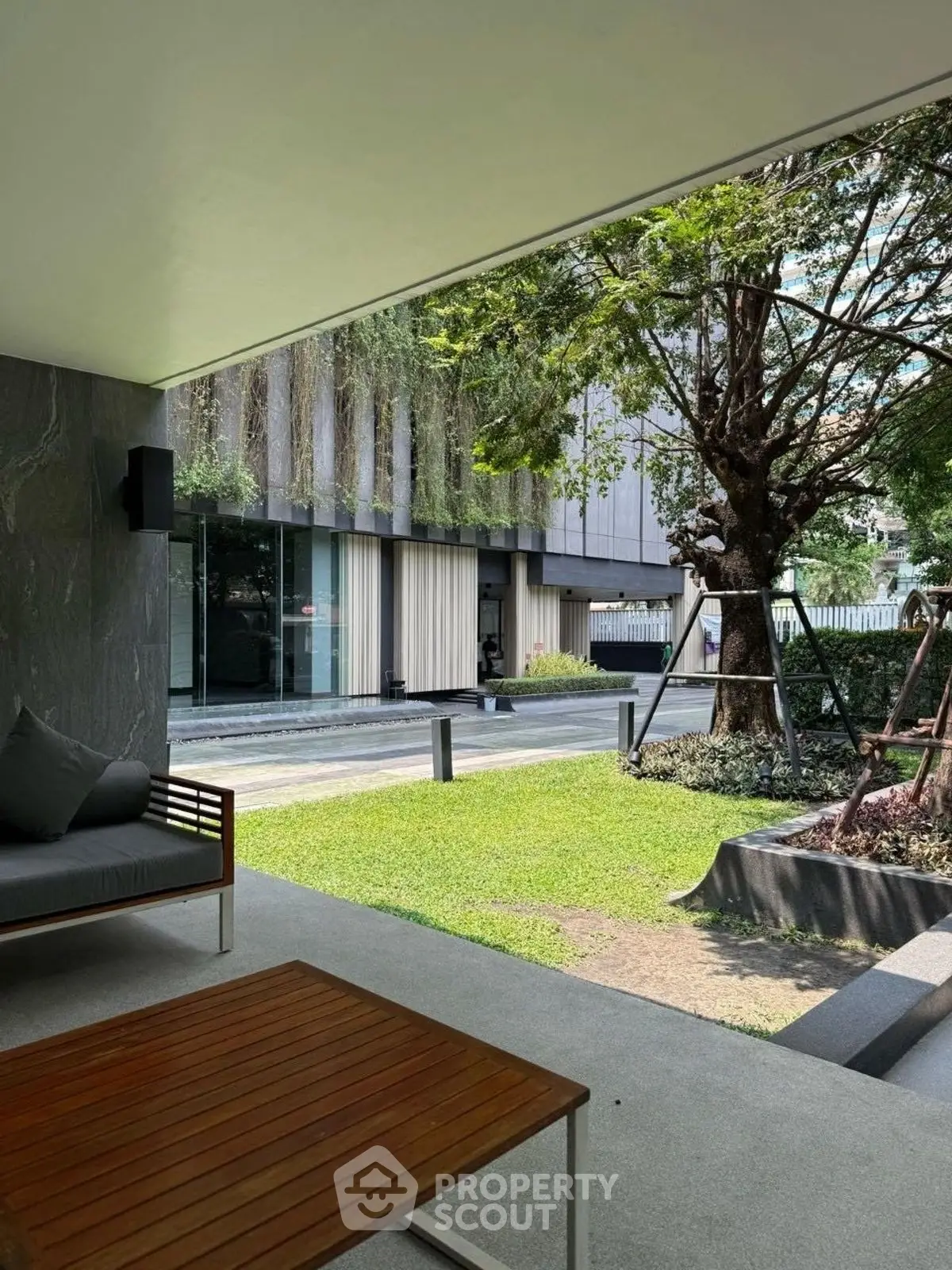 Modern patio with garden view in luxury residential complex