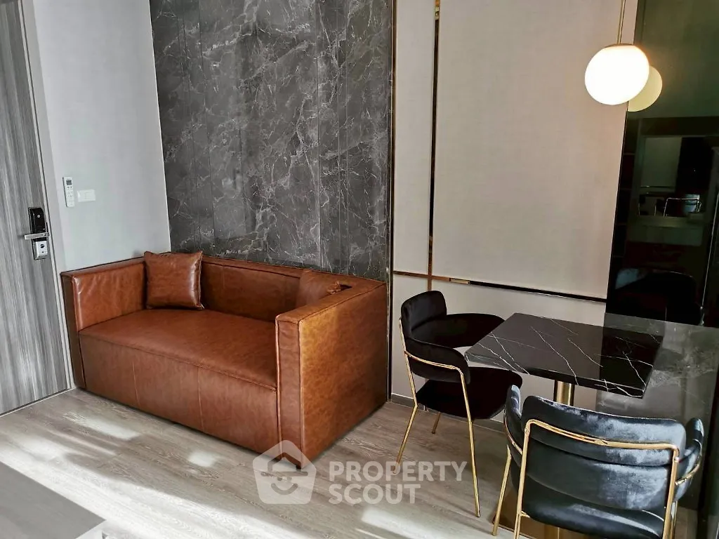 Modern living room with leather sofa and stylish dining area