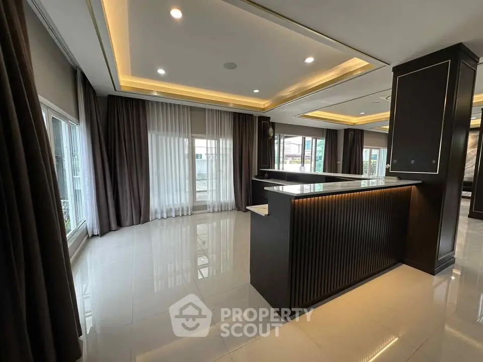 Luxurious modern living room with elegant lighting and large windows