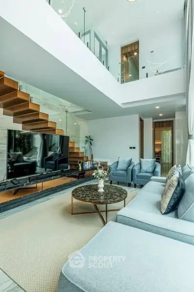 Luxurious modern living room with high ceilings and elegant decor