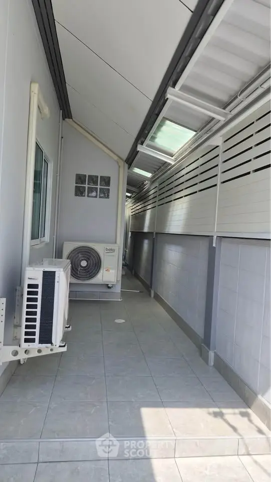 Modern exterior corridor with air conditioning unit and sleek design