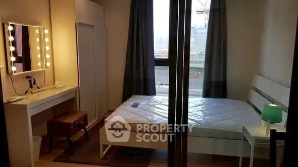 Cozy bedroom with modern furniture and large window view