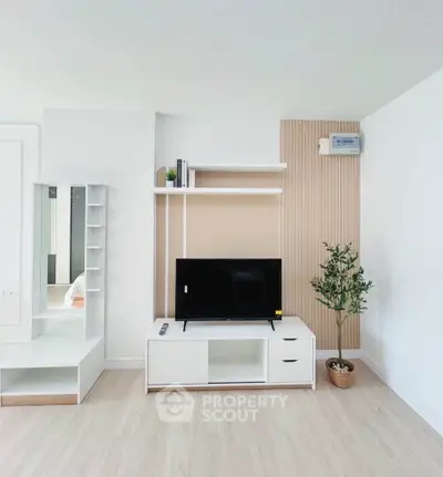 Modern living room with sleek TV stand and minimalist decor