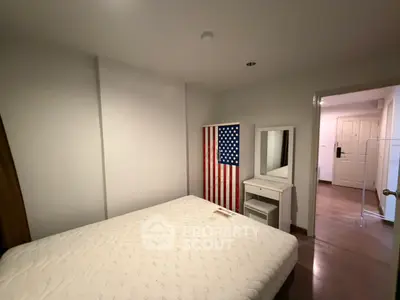 Cozy bedroom with modern decor and ample natural light