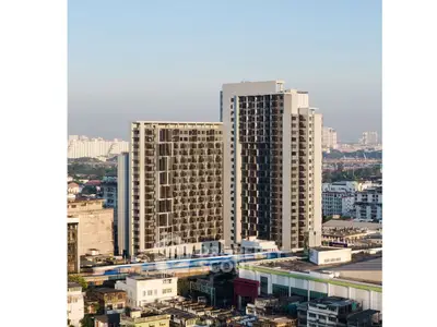 Stunning high-rise building with modern architecture in urban skyline, offering luxurious city living.