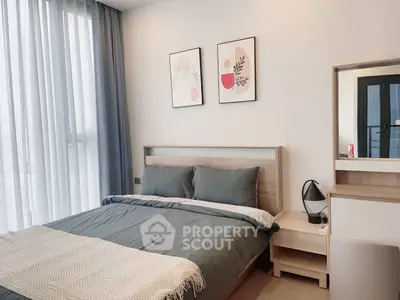 Modern bedroom with stylish decor and natural light
