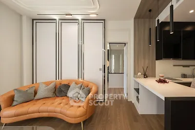 Modern living room with stylish sofa and open kitchen layout