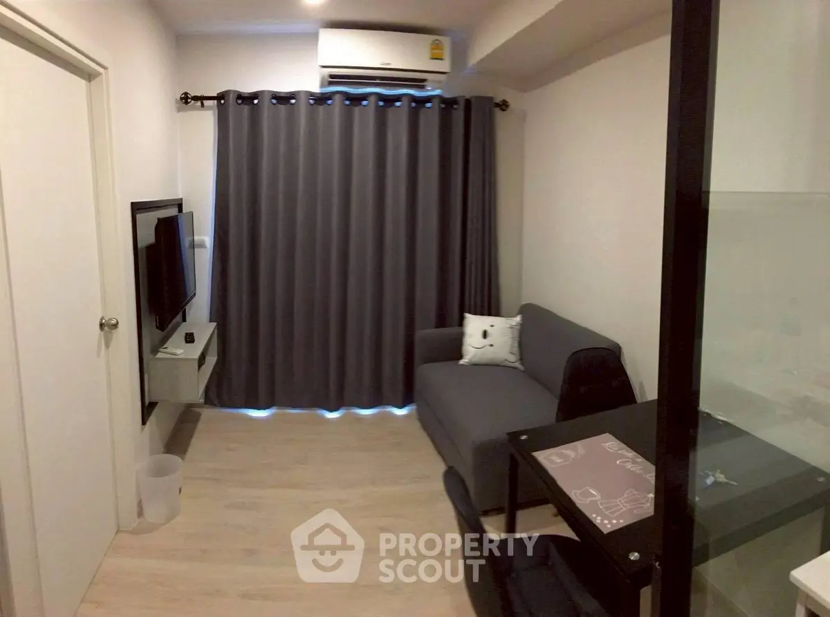 Cozy living room with modern decor and air conditioning