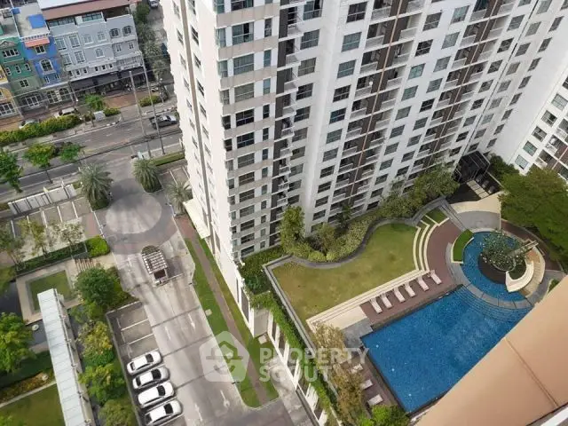 High-rise building with pool and garden view from above