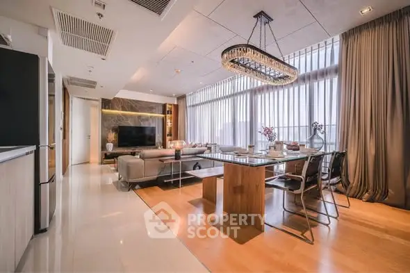 Luxurious modern living room with elegant dining area and floor-to-ceiling windows.