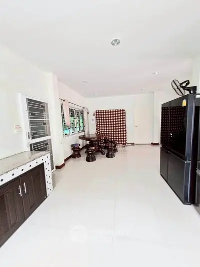 Spacious living room with modern furniture and large windows for natural light.