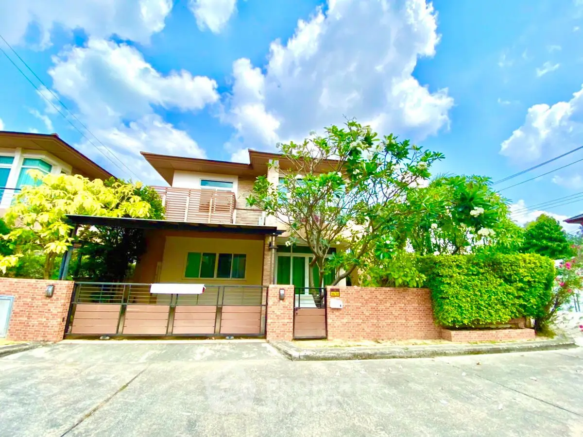 Charming suburban house with lush greenery and modern design, perfect for family living.