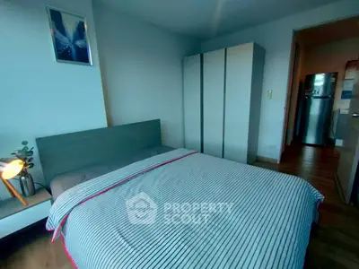 Cozy bedroom with modern decor and ample storage space