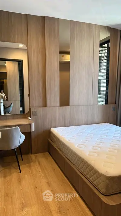 Modern bedroom with wooden accents and cozy ambiance