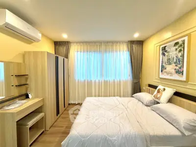 Cozy bedroom with modern decor, featuring a comfortable bed, ample storage, and soft lighting for a relaxing ambiance.