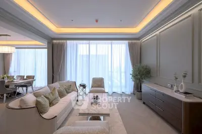 Luxurious living room with elegant decor and large windows in a modern apartment
