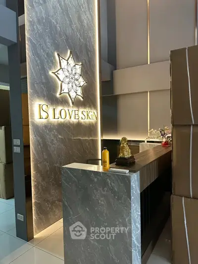 Modern reception area with elegant marble counter and ambient lighting