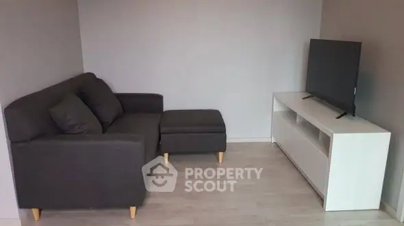 Cozy living room with modern sofa and sleek TV setup