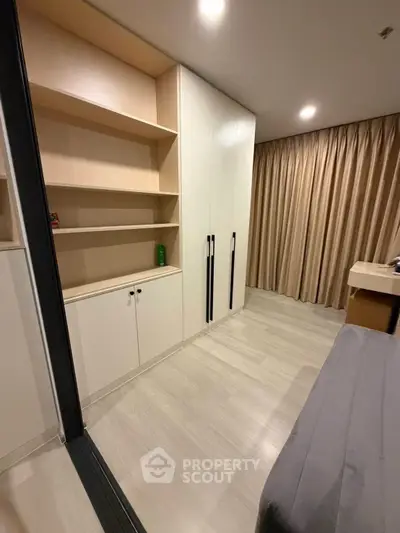 Modern bedroom with built-in storage and sleek design
