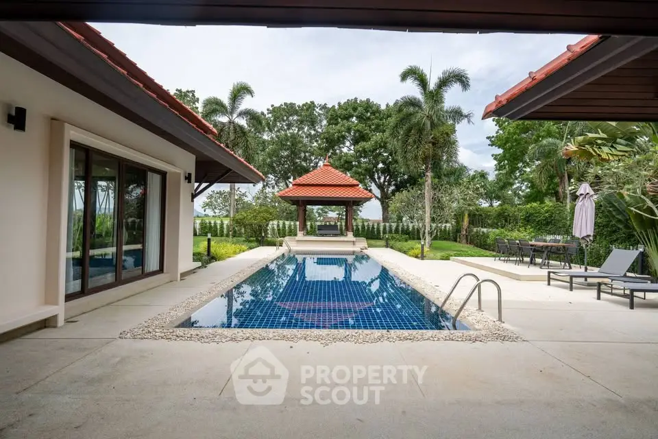 Luxurious villa with private pool and lush garden, perfect for tropical living.