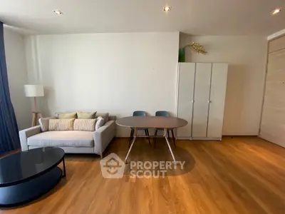 Modern living room with cozy sofa and stylish table, perfect for relaxation.