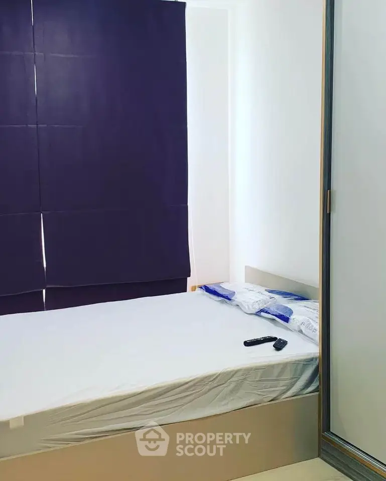 Cozy minimalist bedroom with modern design and ample natural light