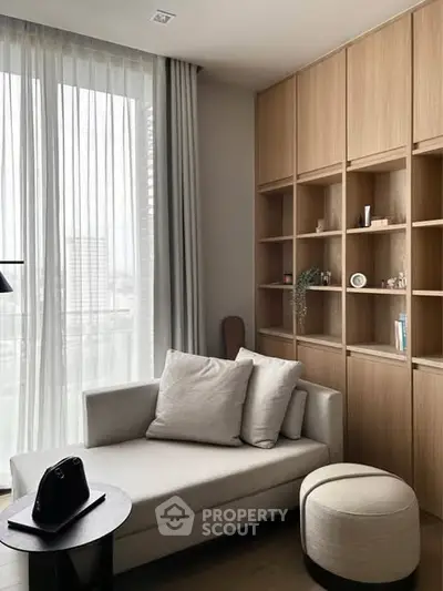 Modern living room with cozy sofa and elegant wooden shelving
