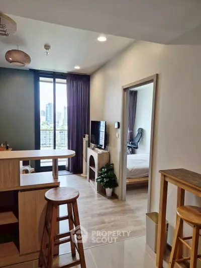 Modern apartment interior with open kitchen and city view balcony