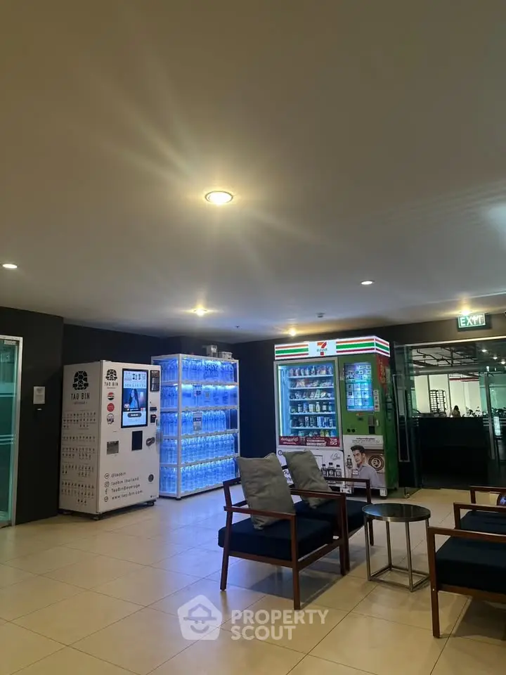 Modern lobby area with vending machines and seating, ideal for relaxation and convenience.