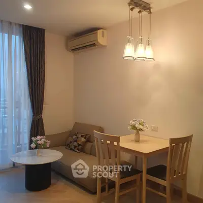 Cozy living room with modern furniture and elegant lighting in a stylish apartment.