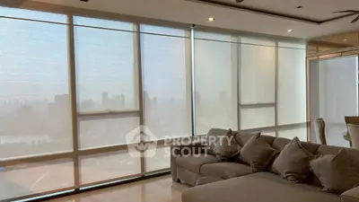 Luxurious living room with panoramic city view and elegant furnishings