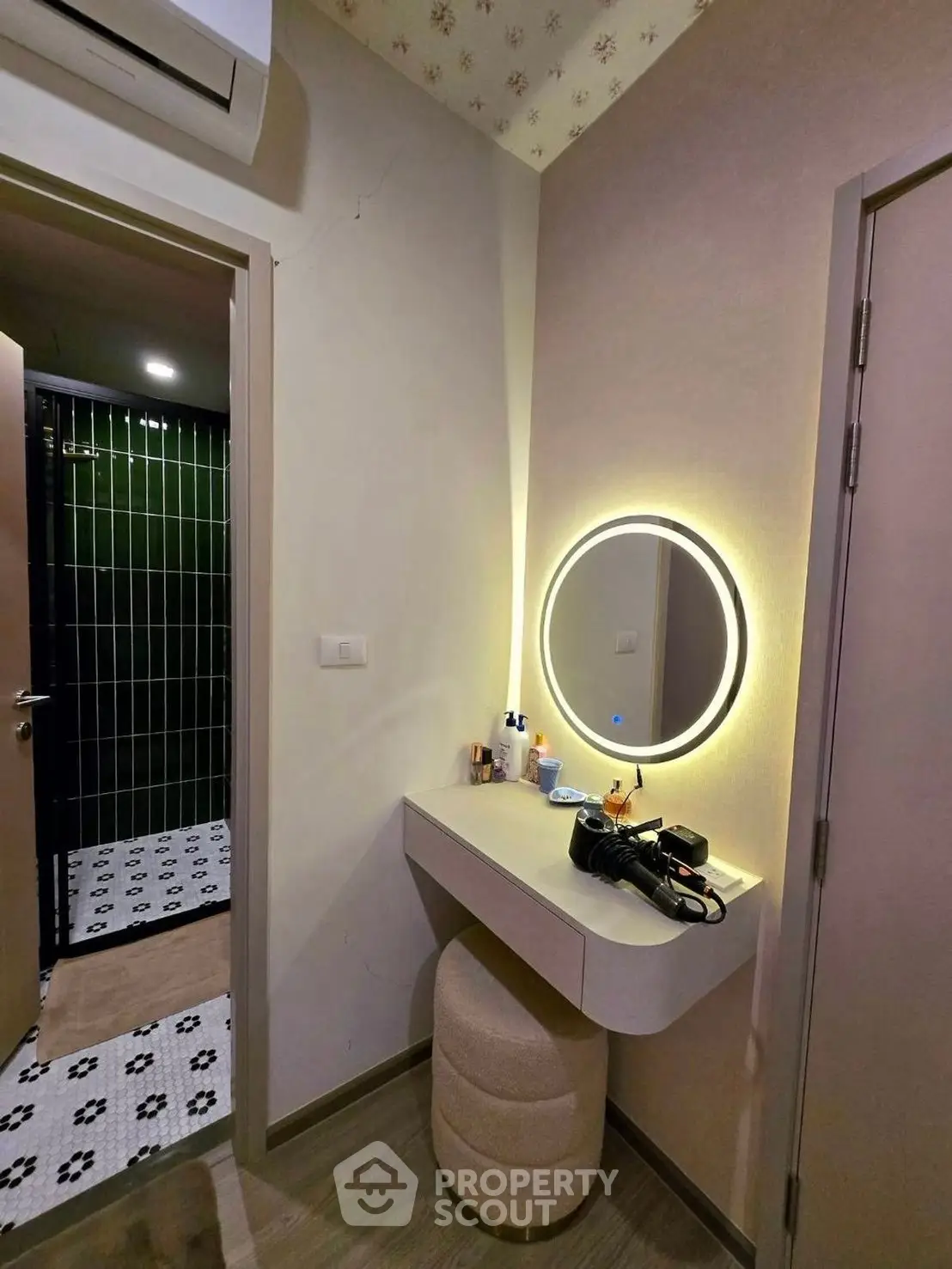 Stylish vanity area with illuminated mirror in modern apartment