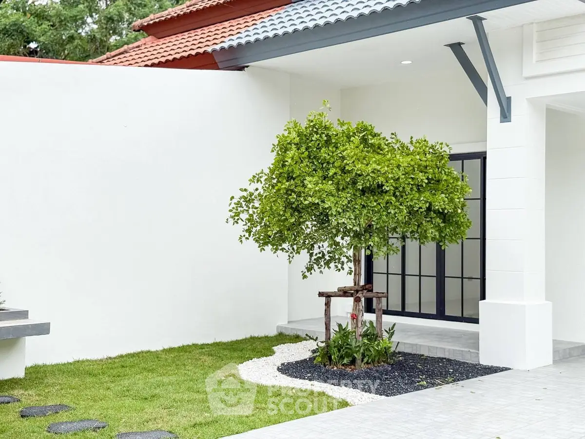 Modern home exterior with lush garden and stylish architecture