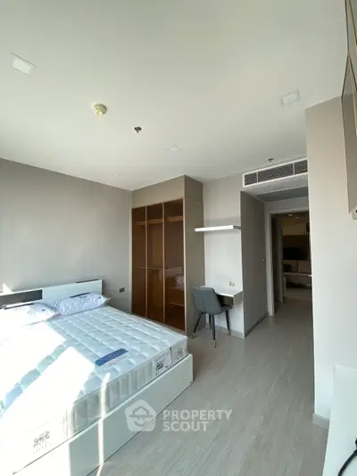 Modern bedroom with sleek design and ample natural light