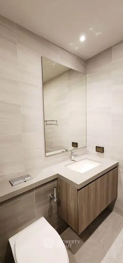 Modern bathroom with sleek design and elegant fixtures in a contemporary home.