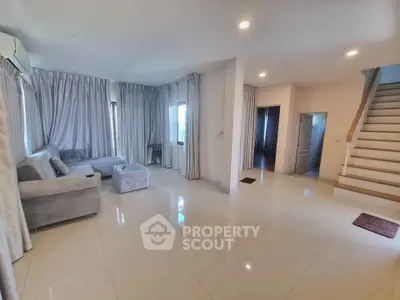 Spacious living room with modern decor and natural light