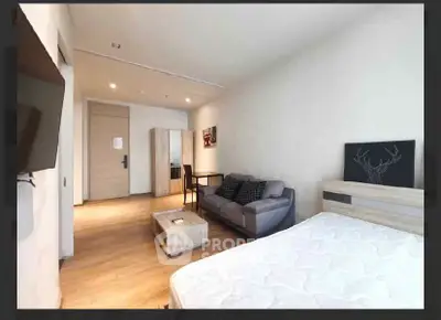 Modern studio apartment with cozy living area and stylish decor