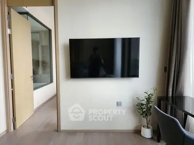 Modern living room with wall-mounted TV and stylish decor