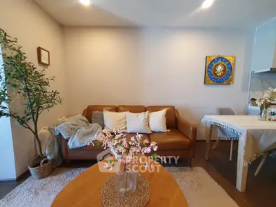 Cozy living room with brown leather sofa and elegant decor