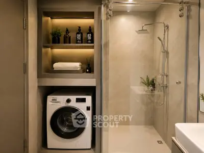 Modern bathroom with washing machine and sleek shower design