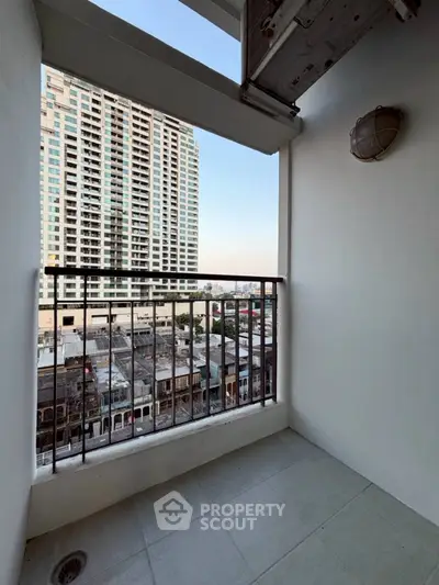 Charming balcony with city view in modern high-rise apartment