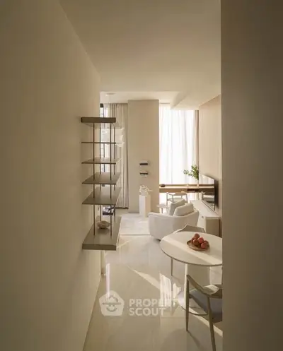 Elegant modern living room with minimalist decor and natural light, featuring a cozy dining area and stylish shelving.