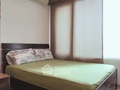 Cozy bedroom with natural light and modern decor, perfect for relaxation.