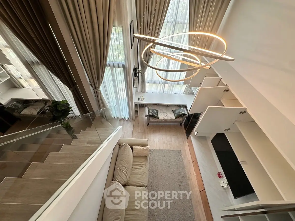 Modern loft apartment with stylish lighting and open layout