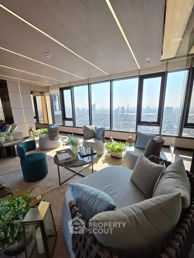 Luxurious high-rise living room with panoramic city views and elegant furnishings.