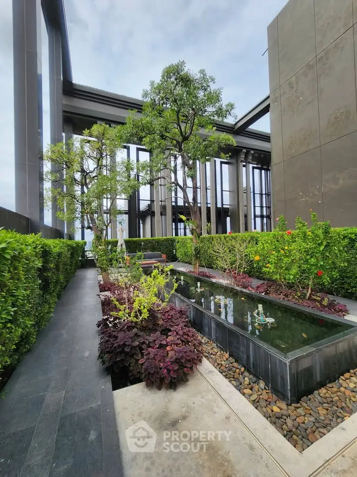 Luxurious rooftop garden with modern design and water feature, offering a serene escape in urban living.