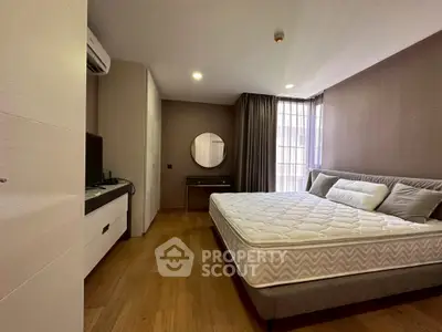 Modern bedroom with stylish decor and natural light