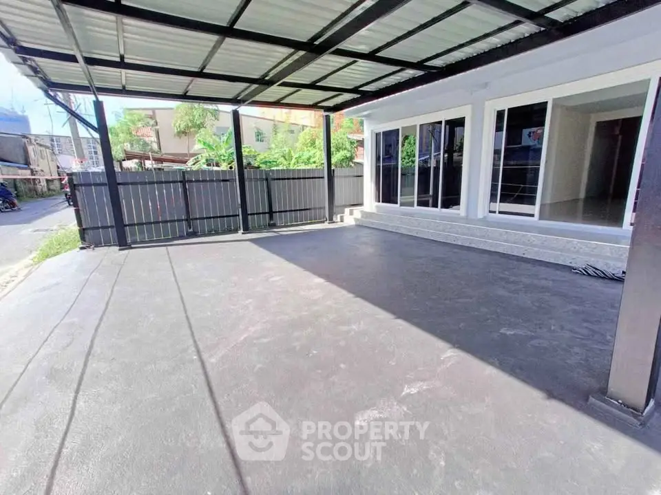 Spacious covered parking area with modern design and ample natural light